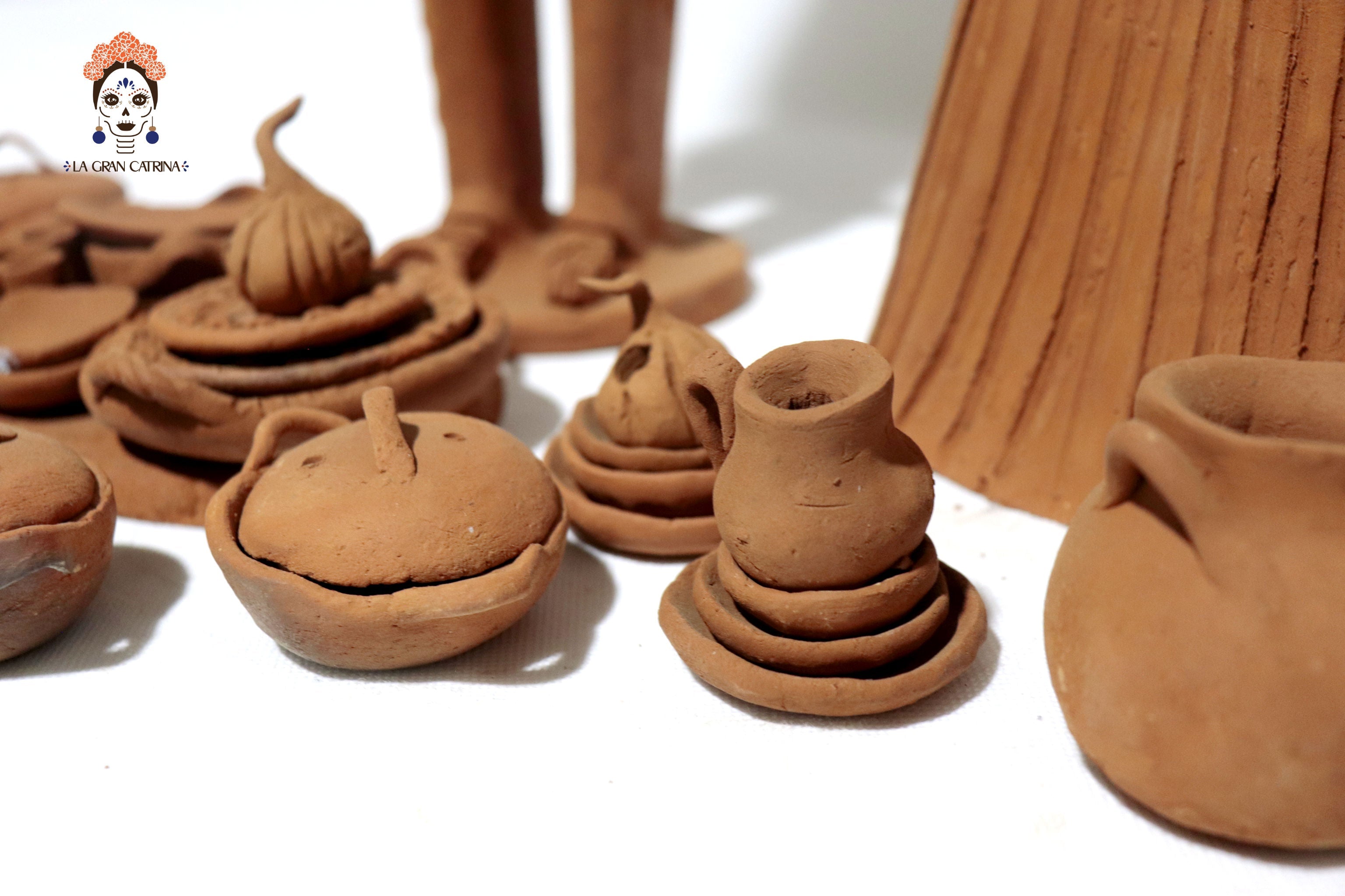 Pair of Catrines artesanos of loza - 20 in. Erika Capula