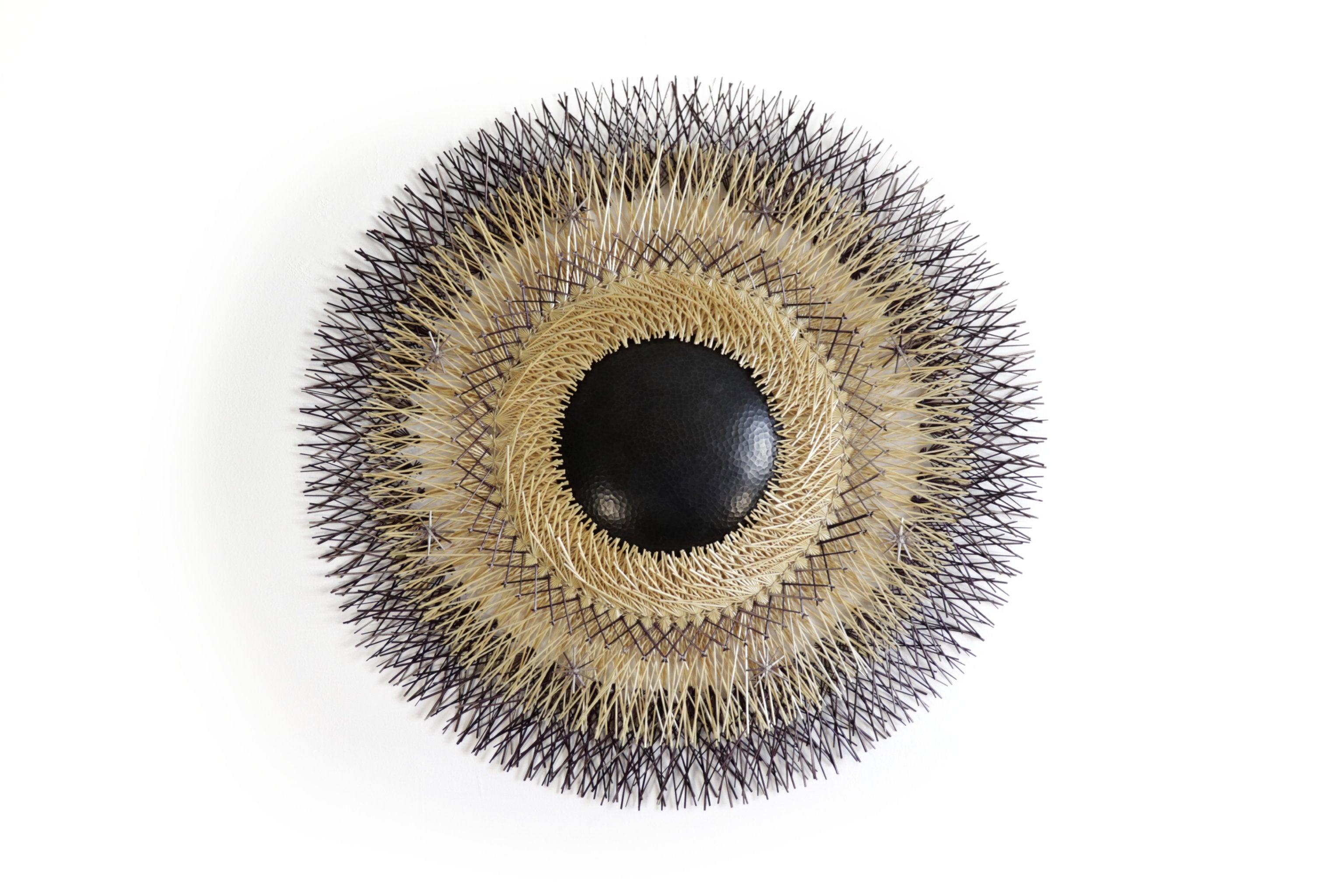 Large 40 in. hand-woven wheat straw wall circle, black and copper design, Michoacán folk art