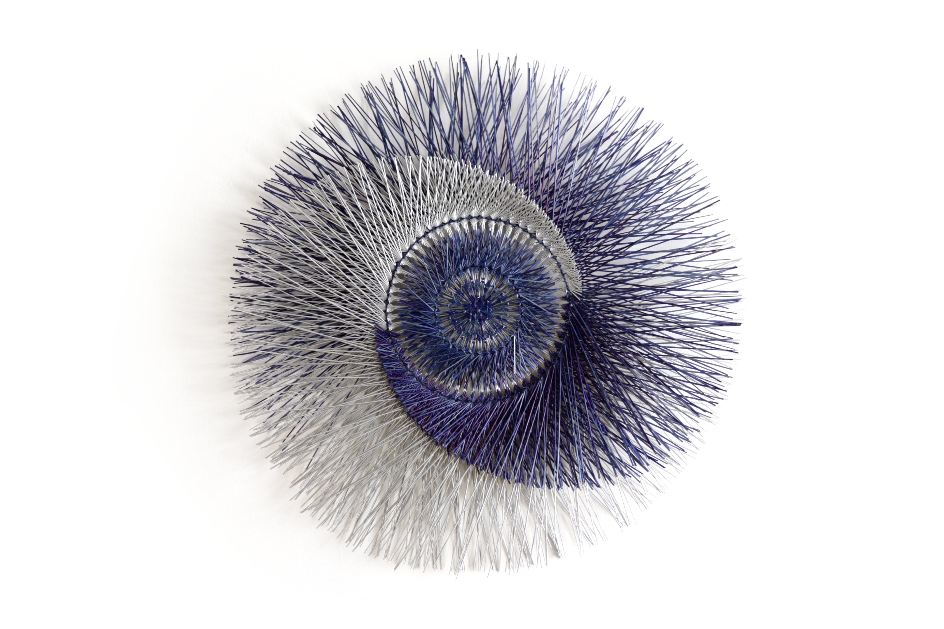 Large 40 in. hand-woven wheat straw wall circle, blue eclipse design with hammered ring