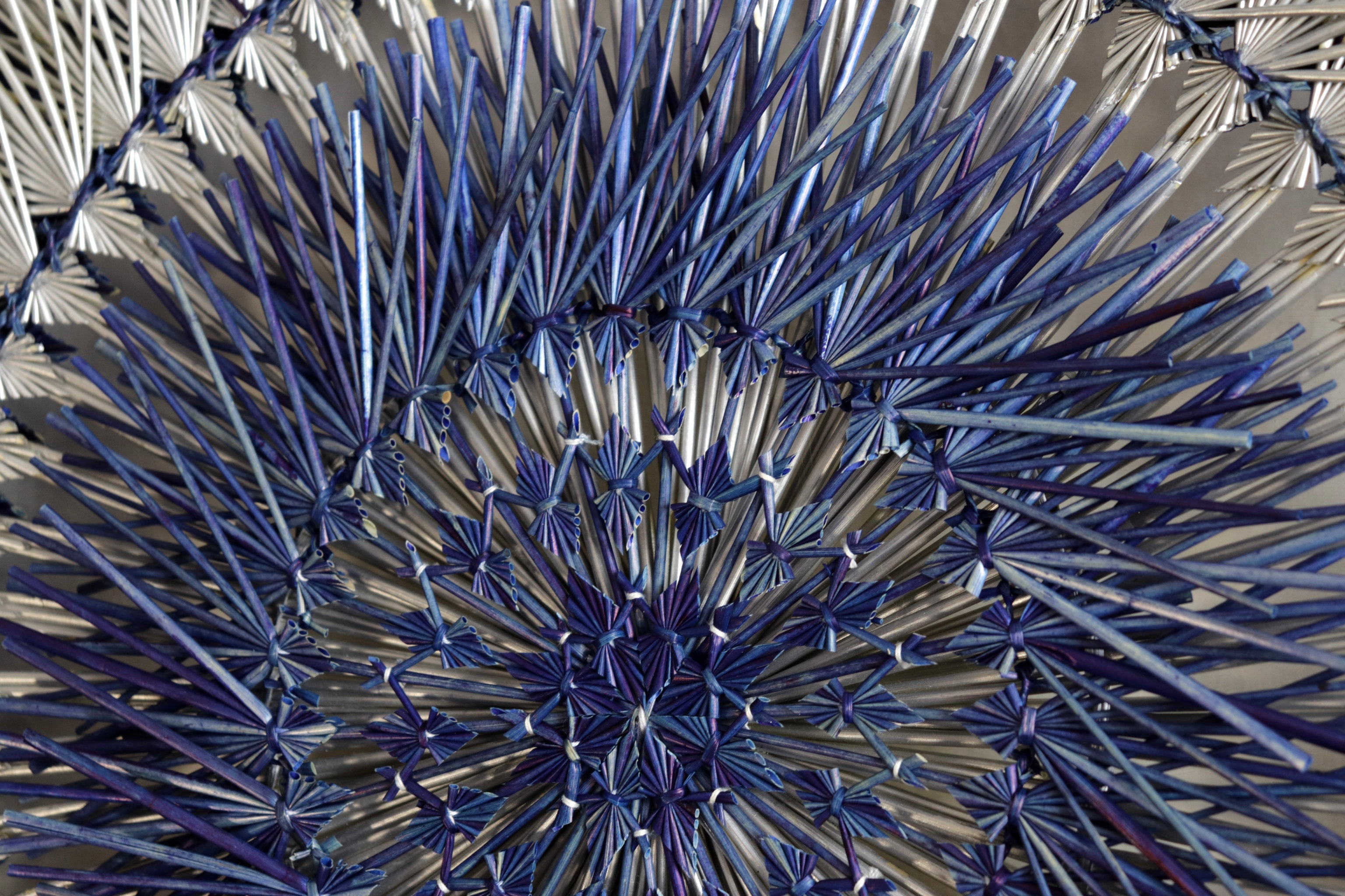 Large 40 in. hand-woven wheat straw wall circle, blue eclipse design with hammered ring