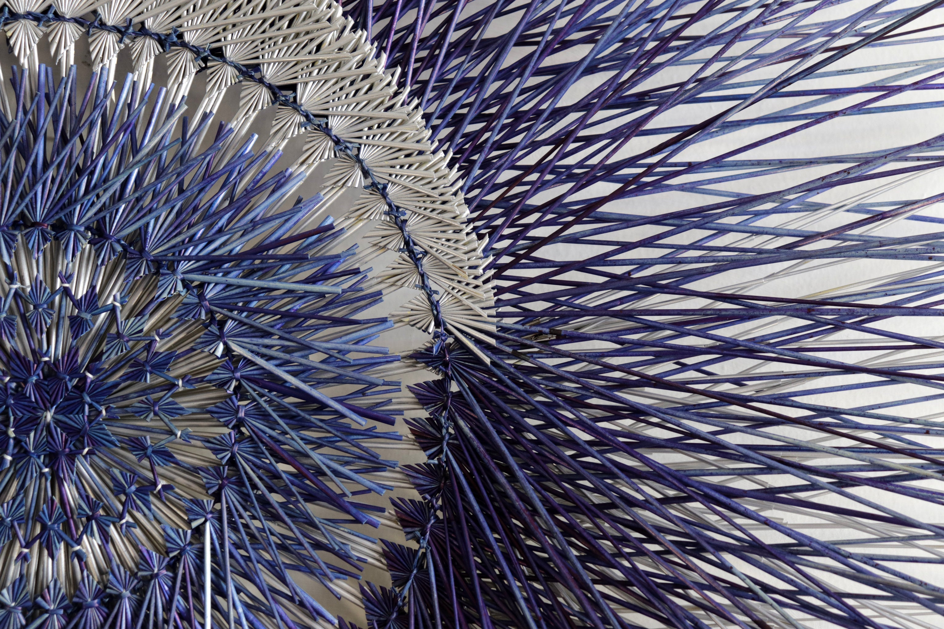 Large 40 in. hand-woven wheat straw wall circle, blue eclipse design with hammered ring